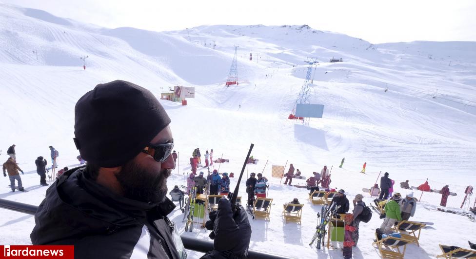 Iranian security man talks on a walkie-talkie at the Dizin ski resort, northwest of Tehran